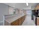 Stylish kitchen featuring long countertops, stainless steel appliances, and an open layout at 701 Peachy Canyon Cir # 201, Las Vegas, NV 89144
