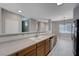 Kitchen features stainless steel appliances and an open layout to the dining area at 701 Peachy Canyon Cir # 201, Las Vegas, NV 89144