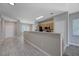 Open floorplan kitchen with stainless appliances, a breakfast bar, and adjacent dining area at 701 Peachy Canyon Cir # 201, Las Vegas, NV 89144
