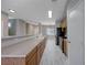 Long kitchen with extended countertops, stainless steel appliances, and great natural light at 701 Peachy Canyon Cir # 201, Las Vegas, NV 89144