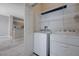 Laundry room with modern washer and dryer, offering convenience and efficiency at 701 Peachy Canyon Cir # 201, Las Vegas, NV 89144