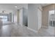 Open living area with durable flooring, closet and neutral paint leading to a bathroom at 701 Peachy Canyon Cir # 201, Las Vegas, NV 89144
