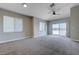 Bright living room with large windows and sliding glass door at 701 Peachy Canyon Cir # 201, Las Vegas, NV 89144