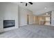 Spacious living room featuring a cozy fireplace and neutral decor at 701 Peachy Canyon Cir # 201, Las Vegas, NV 89144