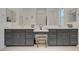 Modern bathroom with double sink vanity, seated makeup area, and white countertops at 709 Corelli Cove St, Henderson, NV 89011