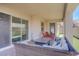 A beautiful, modern covered patio that's perfect for outdoor lounging and entertainment, with easy access to backyard at 709 Corelli Cove St, Henderson, NV 89011