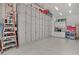 Spacious garage with lots of storage, and epoxy flooring, cabinets running the entire length of the far wall at 709 Corelli Cove St, Henderson, NV 89011