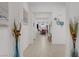 Bright hallway flows through the home, showcasing neutral colors and modern decor, leading to the main living areas at 709 Corelli Cove St, Henderson, NV 89011