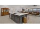 Modern kitchen and open layout feature an island, ideal for entertaining, and flows seamlessly into the living spaces at 709 Corelli Cove St, Henderson, NV 89011