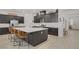 Spacious kitchen boasts a large island with seating, ample cabinetry, and stainless steel appliances, perfect for cooking enthusiasts at 709 Corelli Cove St, Henderson, NV 89011
