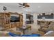 Spacious living room boasts a ceiling fan, open layout and ample seating, perfect for relaxing and entertaining guests at 709 Corelli Cove St, Henderson, NV 89011