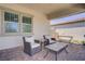 Enjoy the cozy patio with comfortable seating, perfect for relaxing and entertaining outdoors at 709 Corelli Cove St, Henderson, NV 89011