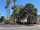 Welcoming entrance to the condominium complex, surrounded by lush greenery and mature trees at 7300 Pirates Cove Rd # 2054, Las Vegas, NV 89145