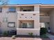 Neutral exterior showcasing a well maintained and landscaped apartment building on a sunny day at 7300 Pirates Cove Rd # 2054, Las Vegas, NV 89145
