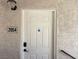 Inviting entryway with a secure keypad and visible unit number, ensuring safety and easy access at 7300 Pirates Cove Rd # 2054, Las Vegas, NV 89145