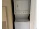 Stacked washer and dryer unit, perfect for convenient laundry access at 7300 Pirates Cove Rd # 2054, Las Vegas, NV 89145