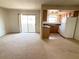 Open-concept layout with combined living and kitchen area, sliding glass door to balcony at 7300 Pirates Cove Rd # 2054, Las Vegas, NV 89145