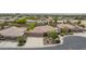 An aerial view of a home with a tile roof and well-maintained landscaping in a residential area at 7719 Villa Montara St, Las Vegas, NV 89123