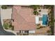 Expansive home featuring a private backyard oasis, complete with a sparkling pool, patio and lush landscaping at 7719 Villa Montara St, Las Vegas, NV 89123
