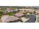 An aerial view of a home with a tile roof and well-maintained landscaping in a desert residential area at 7719 Villa Montara St, Las Vegas, NV 89123
