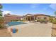 Expansive backyard featuring a sparkling pool, patio, and well-manicured landscaping at 7719 Villa Montara St, Las Vegas, NV 89123
