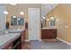 Bright bathroom showcasing dual vanities and modern lighting at 7719 Villa Montara St, Las Vegas, NV 89123