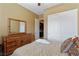 Comfortable bedroom featuring neutral walls, dresser, closet, and comfortable looking bed at 7719 Villa Montara St, Las Vegas, NV 89123