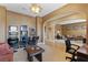 Spacious game room seamlessly connecting to the living area, complete with game machines and a comfortable seating area at 7719 Villa Montara St, Las Vegas, NV 89123