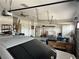 Spacious garage with epoxy flooring, overhead storage racks, cabinets, and a ceiling fan at 7719 Villa Montara St, Las Vegas, NV 89123