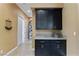 Hallway featuring dark cabinets with countertop space at 7719 Villa Montara St, Las Vegas, NV 89123