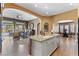 Spacious kitchen island with granite countertops overlooks the living and dining areas at 7719 Villa Montara St, Las Vegas, NV 89123
