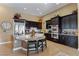 Well-equipped kitchen featuring granite countertops, stainless steel appliances, and a breakfast bar with seating at 7719 Villa Montara St, Las Vegas, NV 89123