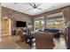 Inviting living room with a fireplace, brick accent wall, and backyard access at 7719 Villa Montara St, Las Vegas, NV 89123