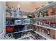Walk-in pantry with ample shelving for organized storage at 7719 Villa Montara St, Las Vegas, NV 89123