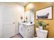 Well-lit bathroom featuring a single sink vanity, toilet, and stylish decor at 794 Calm Crystal Ct # Lot 139, North Las Vegas, NV 89081