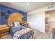 Stylish bedroom features a basketball theme, desk, and cool color palette at 794 Calm Crystal Ct # Lot 139, North Las Vegas, NV 89081