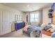 This basketball themed bedroom is stylishly designed with a desk and coordinated art at 794 Calm Crystal Ct # Lot 139, North Las Vegas, NV 89081
