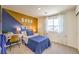 A bedroom featuring color block accent wall and ample natural light at 794 Calm Crystal Ct # Lot 139, North Las Vegas, NV 89081