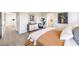 Stylishly decorated bedroom with a queen bed, wood dresser, blue chair, and modern decor at 794 Calm Crystal Ct # Lot 139, North Las Vegas, NV 89081