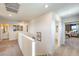 Bright hallway featuring carpet flooring, multiple doorways leading to rooms, and contemporary decor and furnishings at 794 Calm Crystal Ct # Lot 139, North Las Vegas, NV 89081
