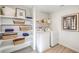 Bright laundry room is fitted with modern appliances and shelving storage at 794 Calm Crystal Ct # Lot 139, North Las Vegas, NV 89081