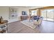 Spacious living room featuring stylish furniture, a patterned rug and sliding door access to the backyard at 794 Calm Crystal Ct # Lot 139, North Las Vegas, NV 89081