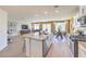 Bright and airy living area with a large kitchen island, dining area, and comfortable living space with modern furnishings at 794 Calm Crystal Ct # Lot 139, North Las Vegas, NV 89081
