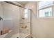 Tiled shower with glass enclosure, shower bench, and built-in soap dish in a modern bathroom at 794 Calm Crystal Ct # Lot 139, North Las Vegas, NV 89081