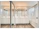 Modern bathroom featuring a large vanity with dual sinks, bathtub and large mirror at 8469 Cheerful Brook Ave, Las Vegas, NV 89143