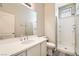 Bathroom featuring tile floors, single sink vanity, large mirror and tiled shower at 8469 Cheerful Brook Ave, Las Vegas, NV 89143