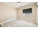 This bedroom features carpeted floors, neutral walls, window and modern light fixture at 8469 Cheerful Brook Ave, Las Vegas, NV 89143