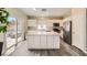 Bright, open kitchen featuring a large island, stainless steel appliances, and modern finishes at 8469 Cheerful Brook Ave, Las Vegas, NV 89143