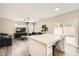 Open-concept kitchen with a large island, adjacent to a comfortable living area at 8469 Cheerful Brook Ave, Las Vegas, NV 89143