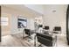Spacious living room featuring neutral tones, wood-look floors, and modern decor at 8469 Cheerful Brook Ave, Las Vegas, NV 89143